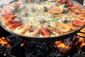 freshly cooked Paella on open fire
